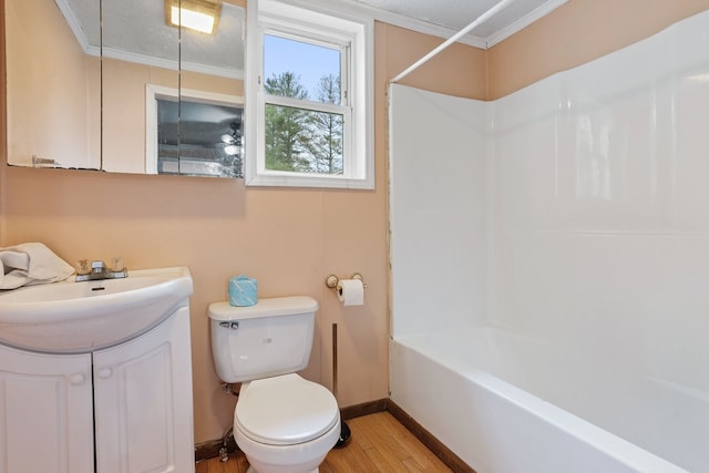 full bathroom with crown molding, a textured ceiling, toilet, vanity, and hardwood / wood-style flooring