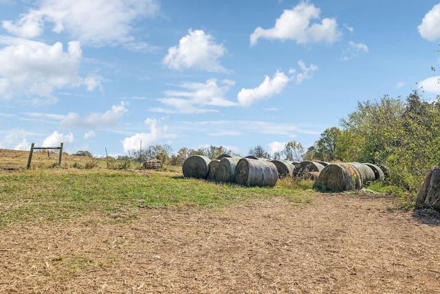 view of yard with a rural view