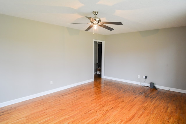 unfurnished room with ceiling fan and light hardwood / wood-style floors