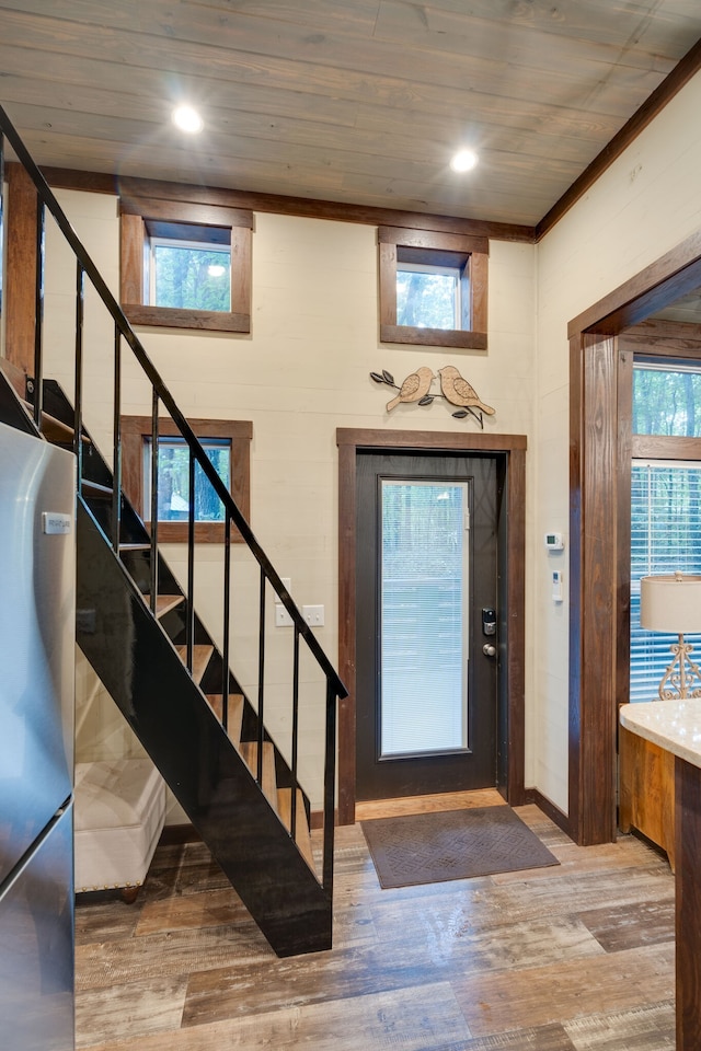 entryway featuring wood ceiling and light hardwood / wood-style floors