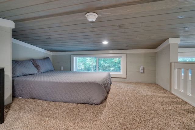 bedroom with carpet flooring and wood ceiling