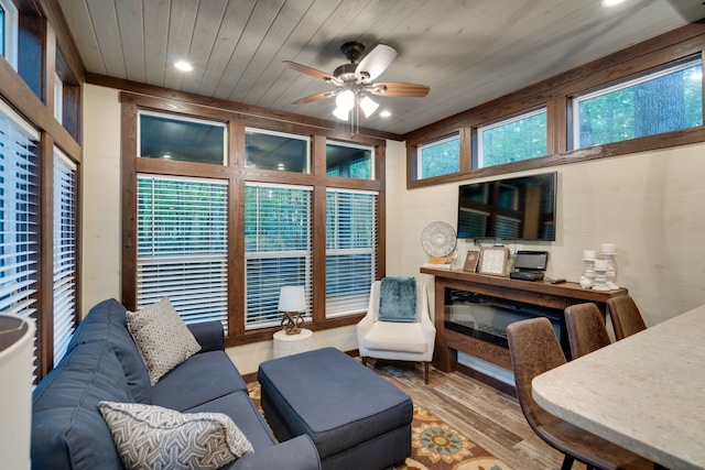 living room with ceiling fan, wood ceiling, and hardwood / wood-style flooring