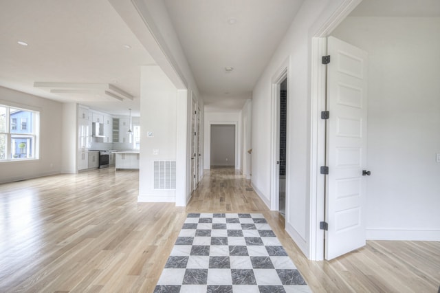 hallway featuring light wood-type flooring