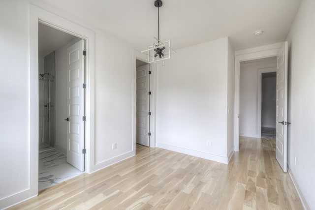 spare room with light hardwood / wood-style flooring