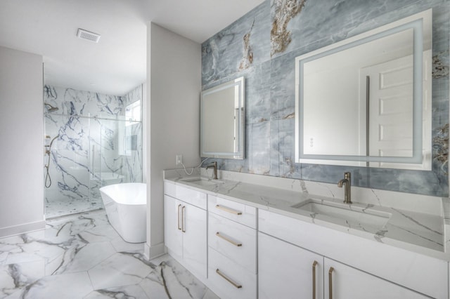 bathroom featuring separate shower and tub and vanity