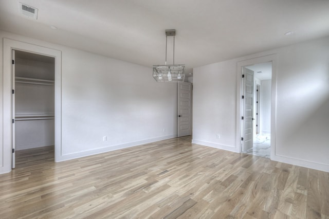 unfurnished dining area featuring light hardwood / wood-style flooring