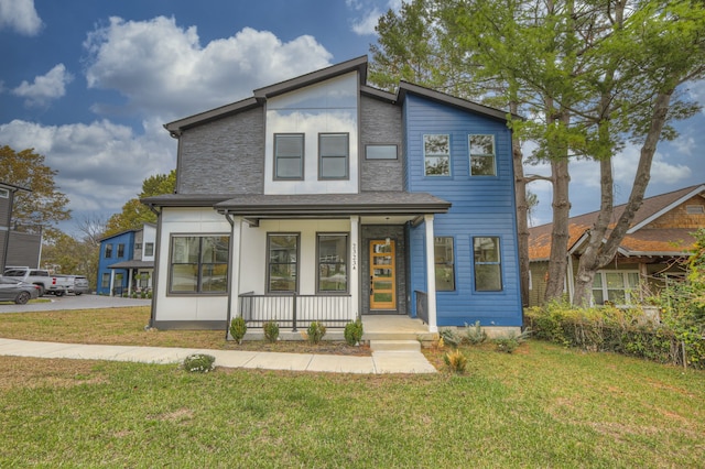 view of front of home featuring a porch and a front yard