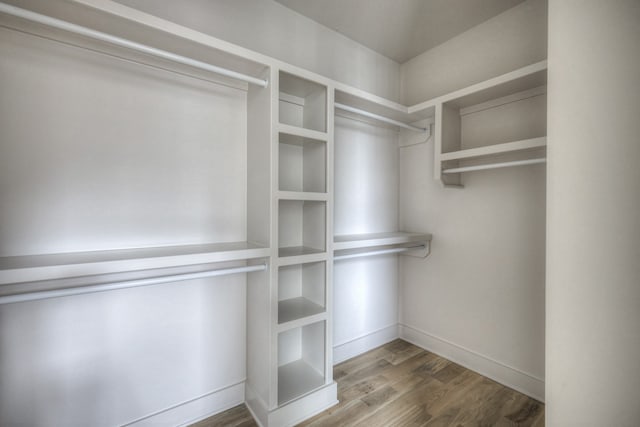 walk in closet featuring hardwood / wood-style floors