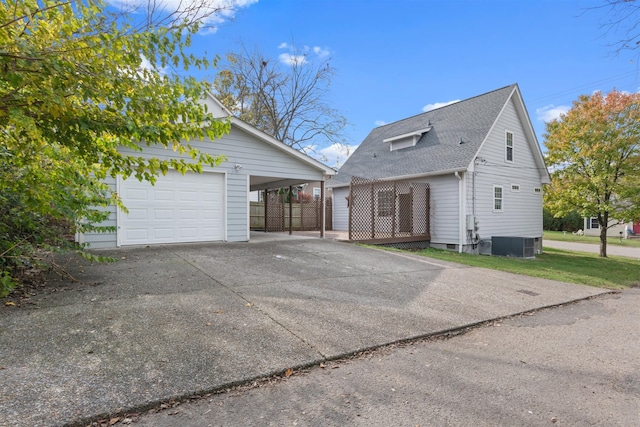 exterior space featuring a carport and central AC