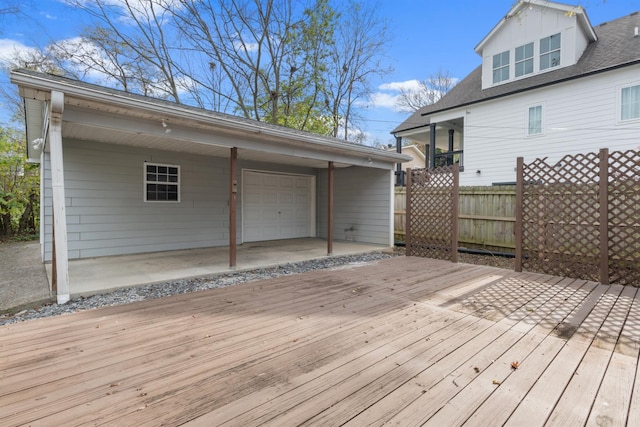 wooden deck featuring a garage