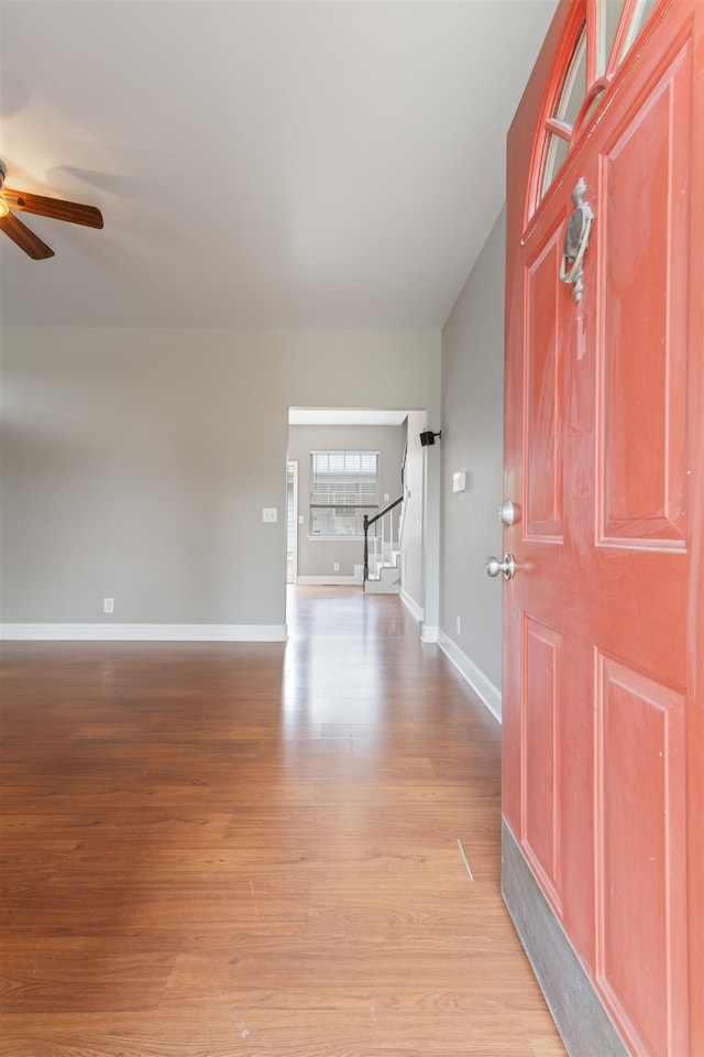 foyer featuring ceiling fan and light wood-type flooring