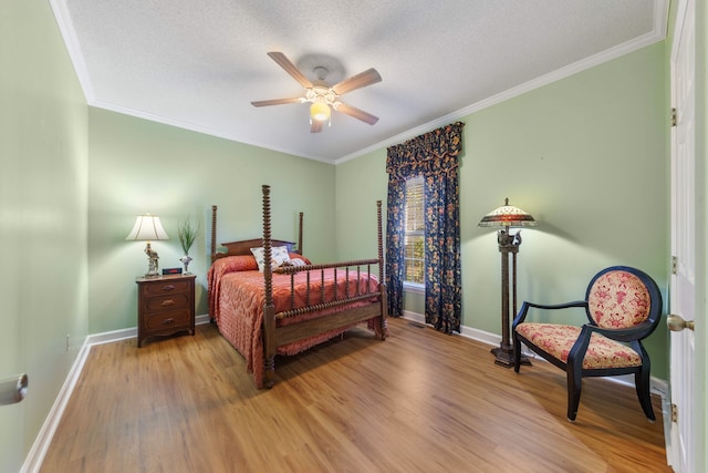 bedroom featuring ceiling fan, wood-type flooring, and ornamental molding