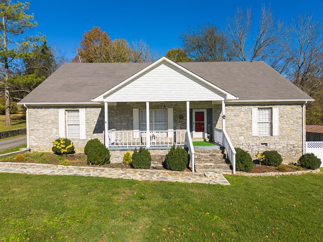 view of front of house with a porch and a front lawn