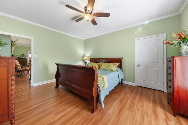 bedroom featuring light hardwood / wood-style flooring, ceiling fan, and ornamental molding