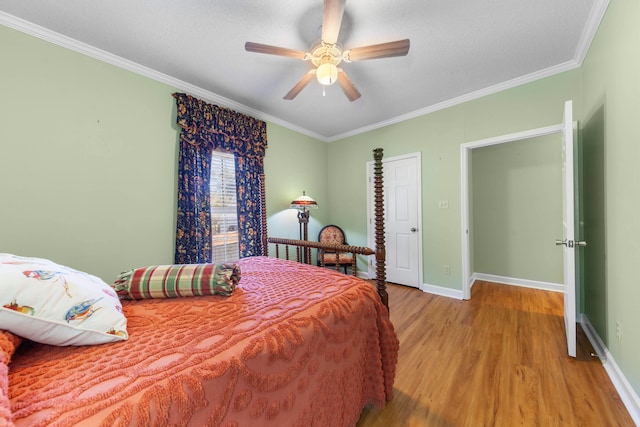 bedroom featuring ceiling fan, crown molding, and light hardwood / wood-style flooring