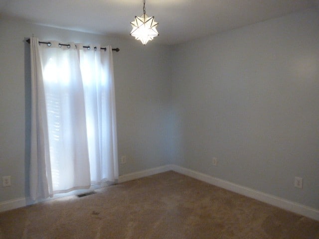 view of carpeted spare room