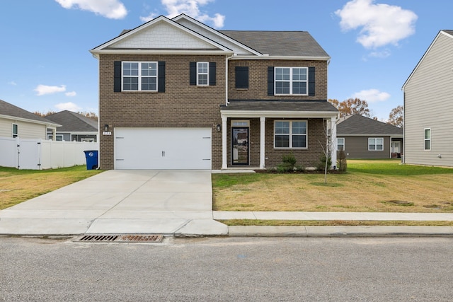 view of front of home with a garage and a front lawn