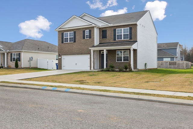 view of front of property featuring a garage and a front lawn