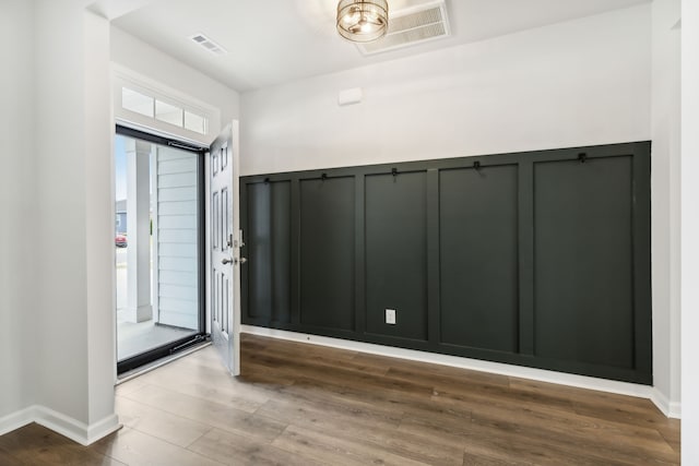 foyer entrance featuring wood-type flooring