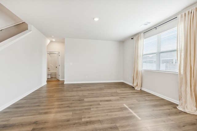 empty room featuring wood-type flooring