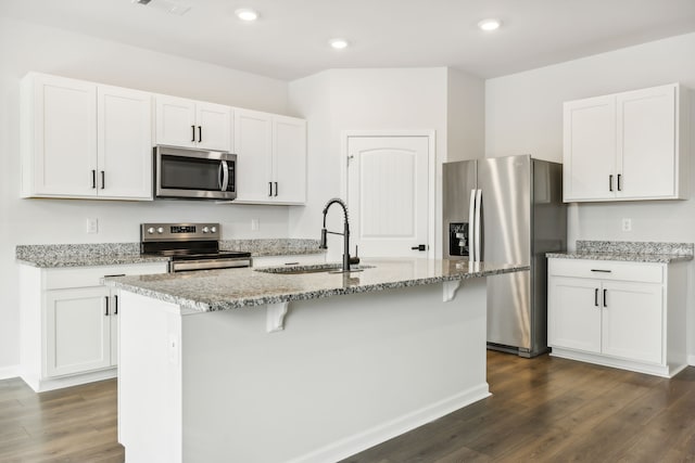 kitchen with white cabinetry, sink, a center island with sink, and appliances with stainless steel finishes