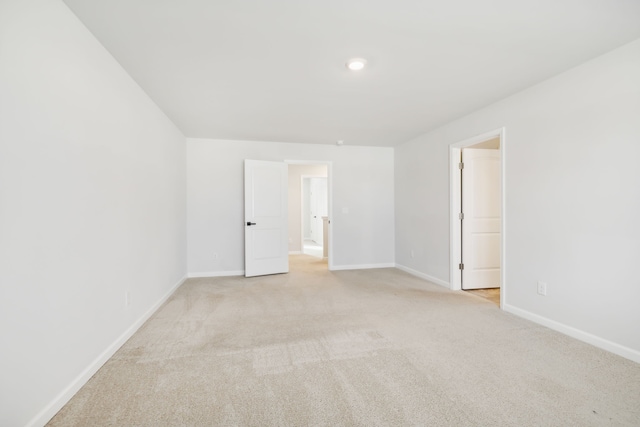 empty room with light colored carpet