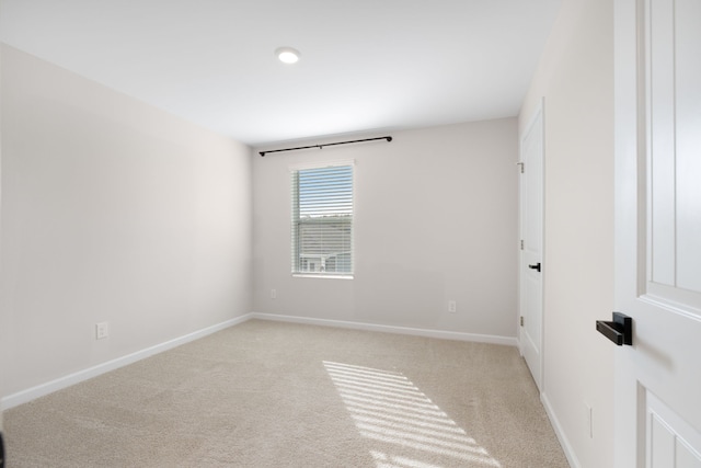 empty room featuring light colored carpet