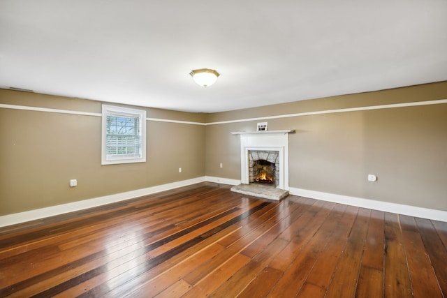 unfurnished living room featuring dark wood-type flooring