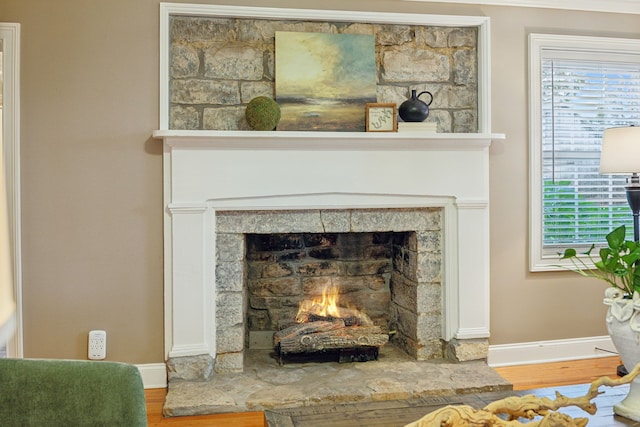 interior details featuring a fireplace and hardwood / wood-style floors