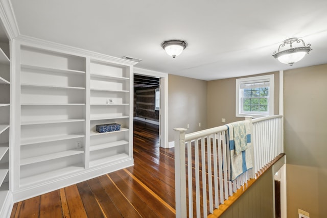 corridor featuring dark hardwood / wood-style flooring