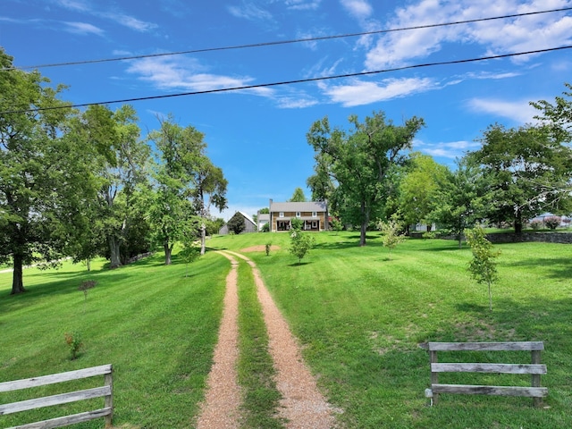 view of property's community featuring a yard