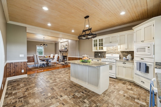 kitchen with white cabinets, a center island, white appliances, and wood ceiling