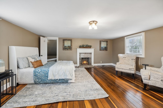 bedroom with dark hardwood / wood-style floors