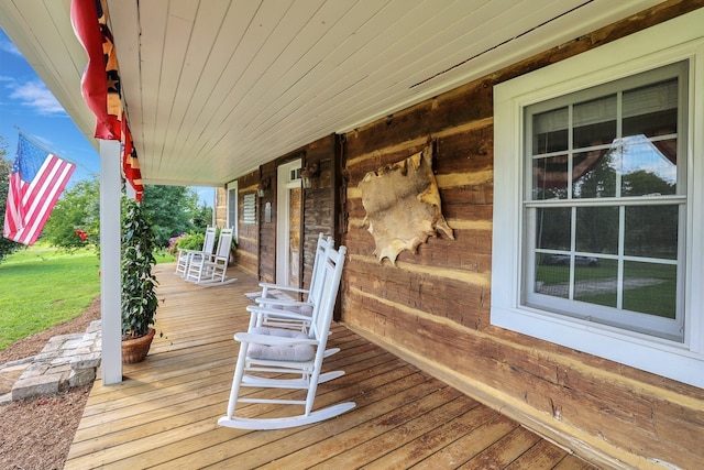 wooden terrace with a porch