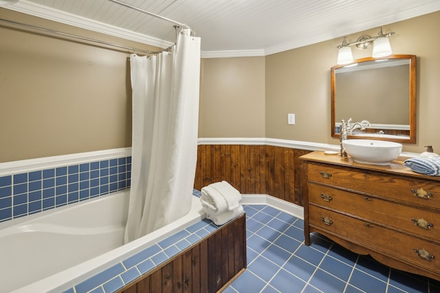 bathroom featuring vanity, crown molding, wooden walls, and shower / tub combo with curtain