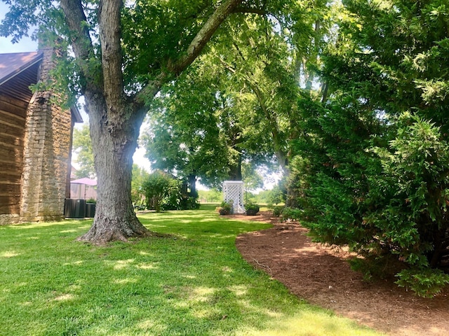 view of yard featuring central AC unit