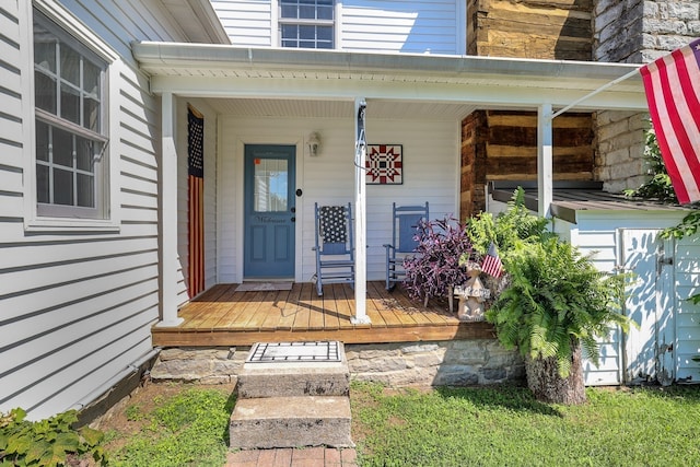 doorway to property with a porch