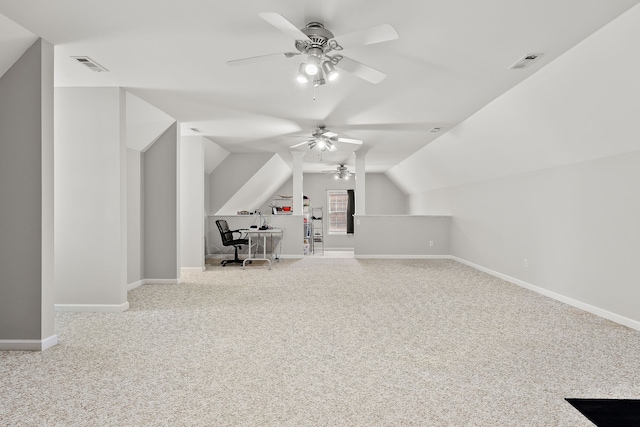 additional living space featuring ceiling fan, light colored carpet, and vaulted ceiling