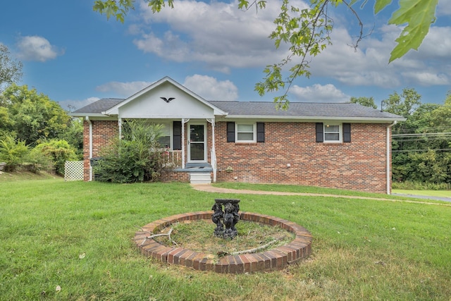 ranch-style house featuring a porch and a front yard