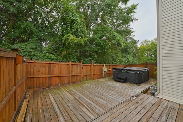 deck featuring a hot tub