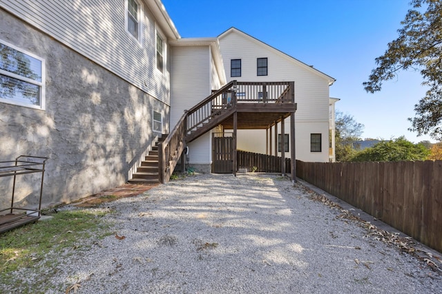 back of house featuring a deck