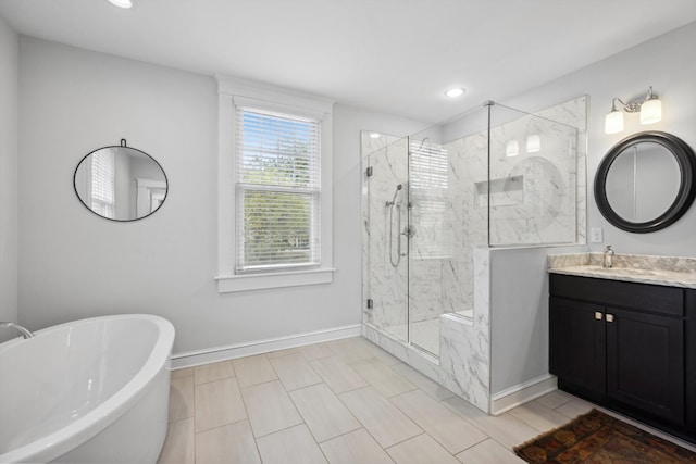 bathroom featuring separate shower and tub and vanity