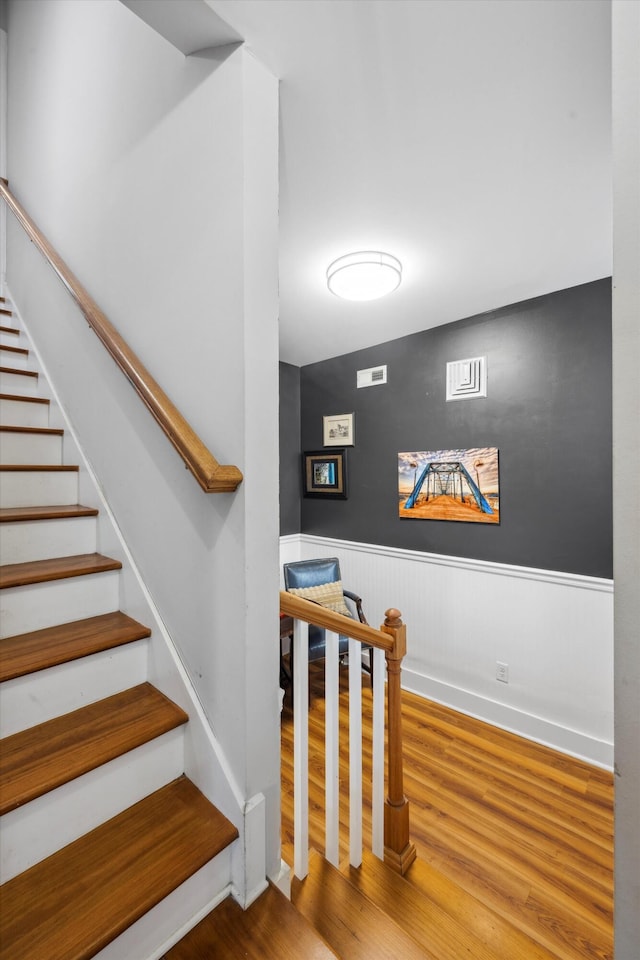 stairs with wood-type flooring