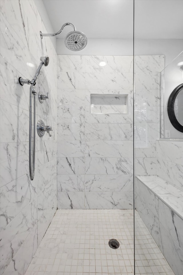 bathroom with tiled shower