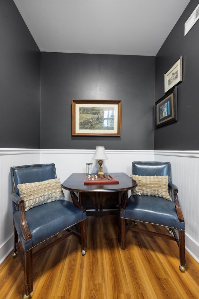 sitting room with hardwood / wood-style floors