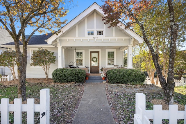 tudor house featuring a porch