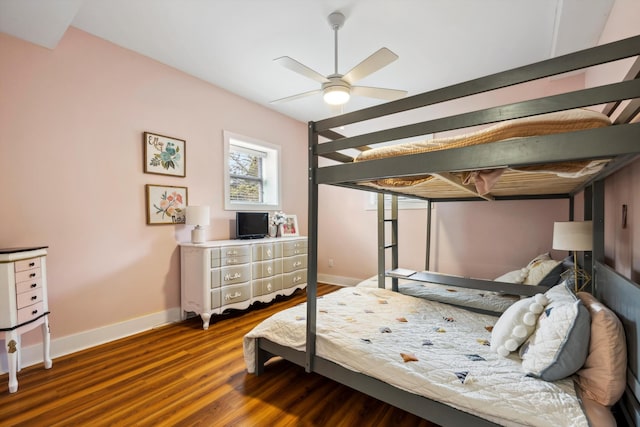 bedroom featuring ceiling fan and dark hardwood / wood-style floors