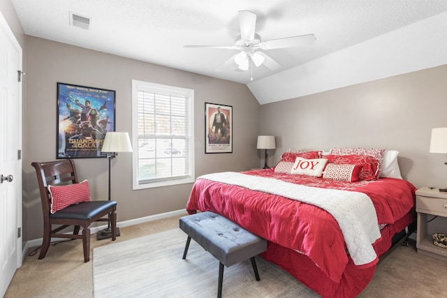 bedroom with lofted ceiling, light carpet, and ceiling fan