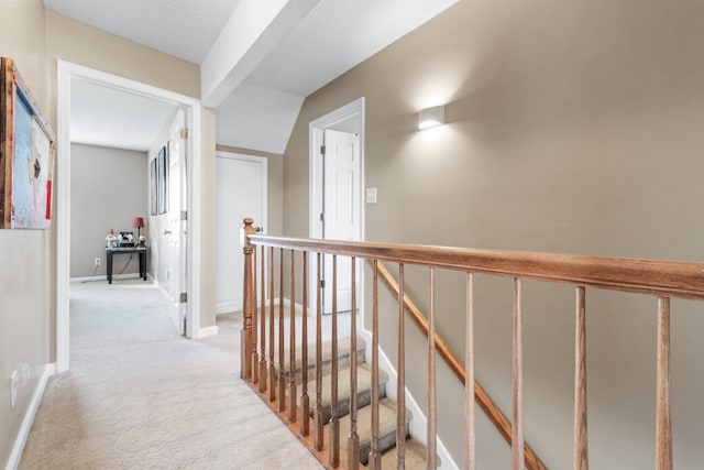 corridor with light colored carpet