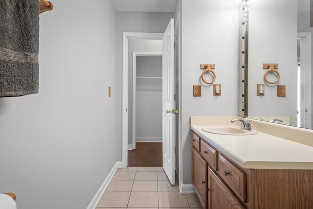 bathroom featuring tile patterned flooring and vanity